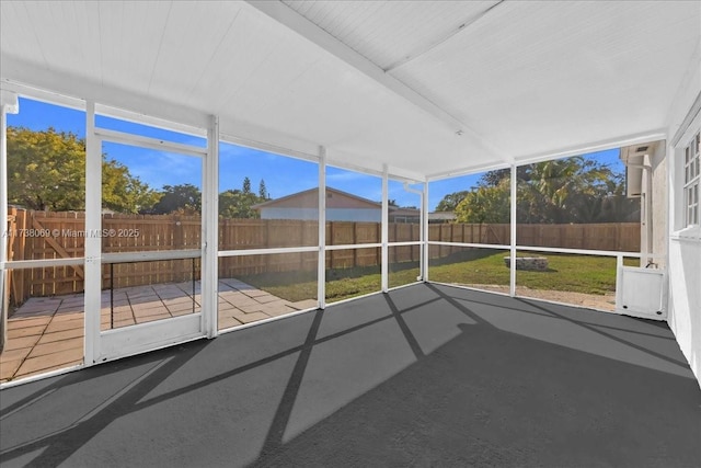 unfurnished sunroom with a wealth of natural light