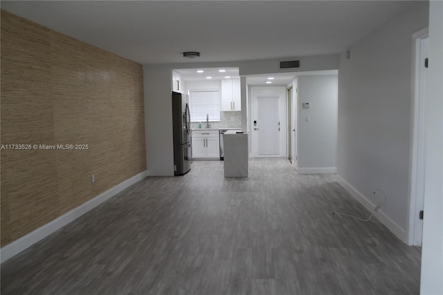 interior space with dark wood-type flooring and sink