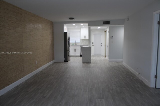 interior space featuring dark wood-type flooring and sink