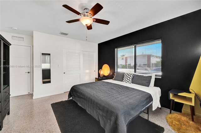 bedroom featuring ceiling fan and a closet