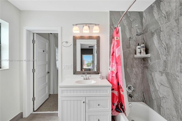 bathroom with vanity and shower / bath combination with curtain