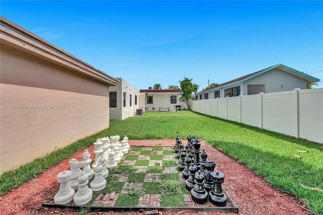 view of yard featuring central air condition unit