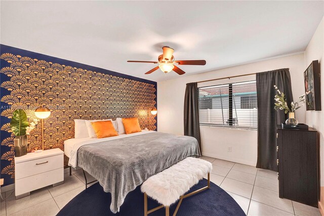 tiled bedroom featuring ceiling fan