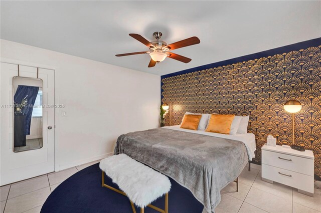 bedroom with ceiling fan and light tile patterned flooring