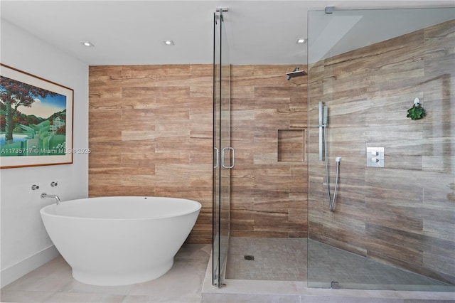 bathroom with shower with separate bathtub