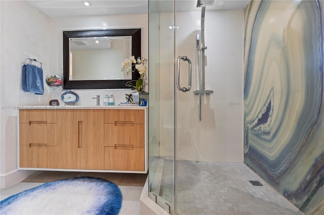 bathroom with vanity, tile patterned floors, and a shower with shower door