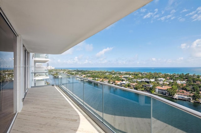 balcony featuring a water view