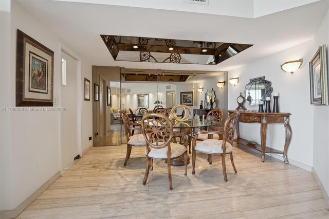 dining room with light hardwood / wood-style flooring