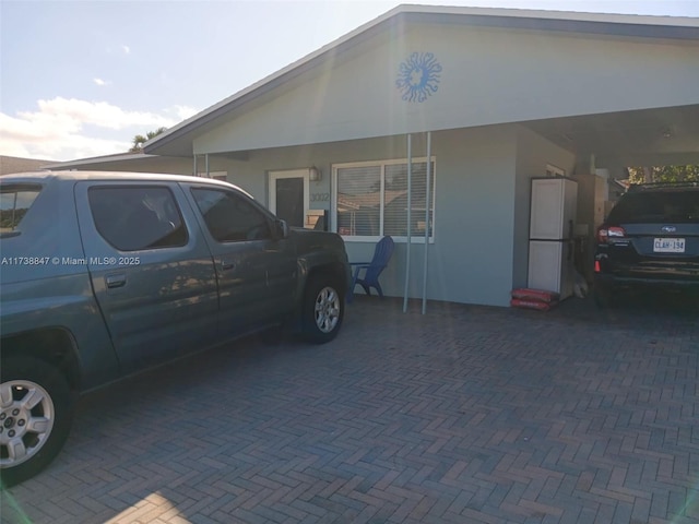 view of side of property with a carport