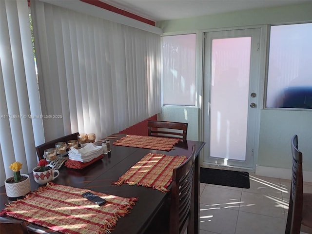 tiled bedroom with multiple windows