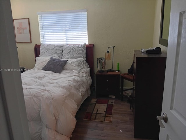 bedroom featuring hardwood / wood-style flooring