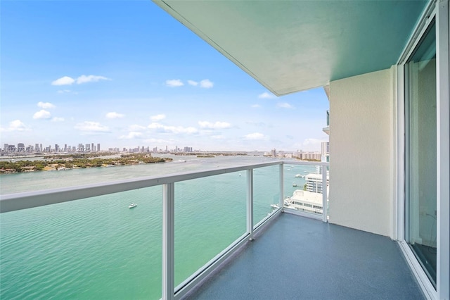 balcony featuring a water view