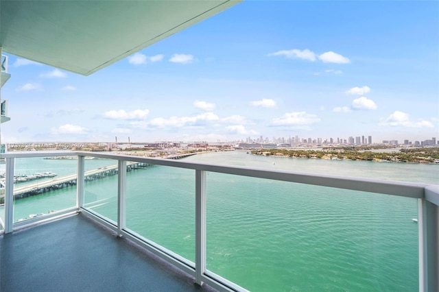 balcony featuring a water view