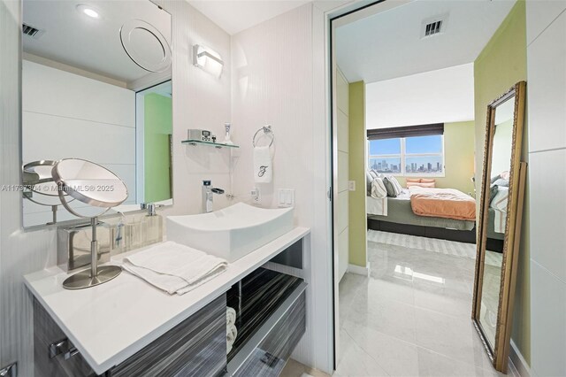 bathroom with tile patterned flooring and vanity