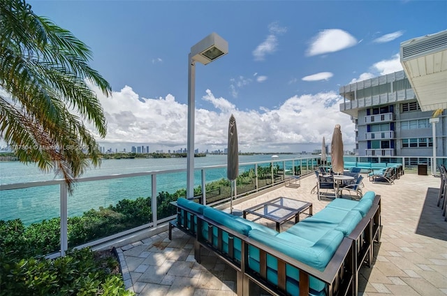 view of patio featuring an outdoor living space and a water view