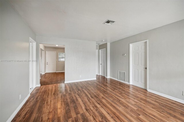 spare room with hardwood / wood-style flooring