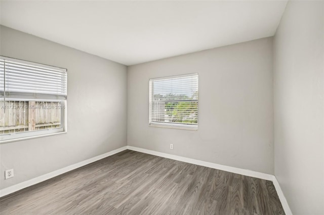 unfurnished room featuring hardwood / wood-style floors