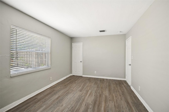 empty room featuring dark hardwood / wood-style floors