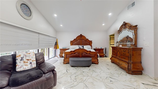 bedroom featuring high vaulted ceiling