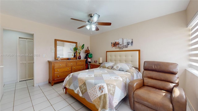 tiled bedroom featuring a closet and ceiling fan