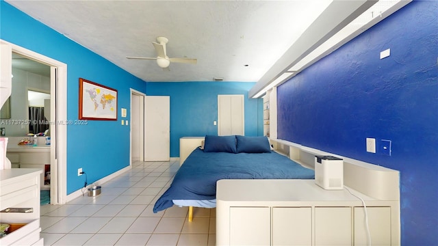 tiled bedroom featuring ceiling fan