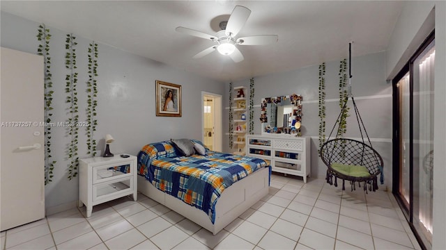 tiled bedroom featuring ceiling fan