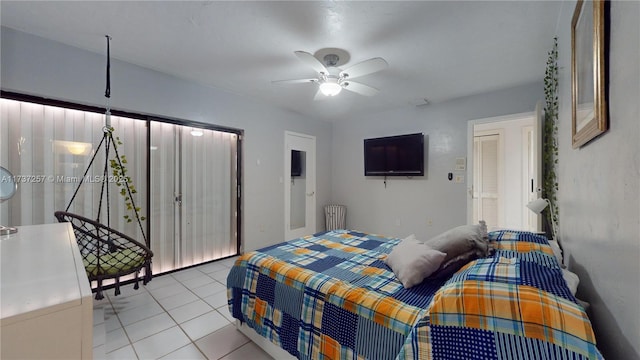 bedroom featuring light tile patterned floors and ceiling fan