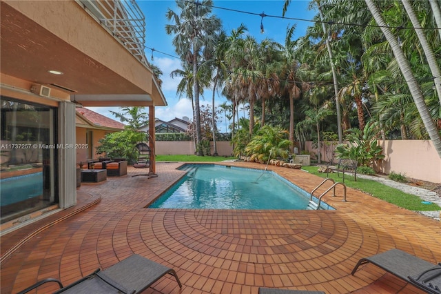 view of swimming pool featuring a patio