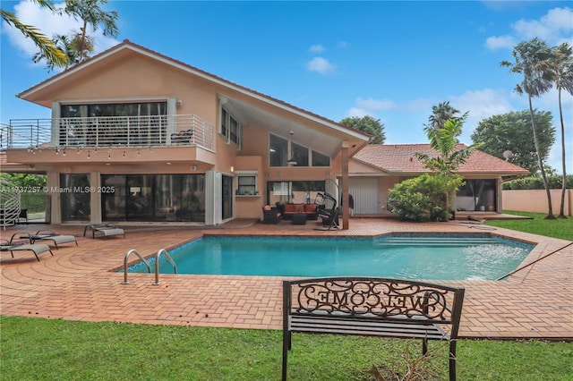 view of pool with a patio and an outdoor hangout area