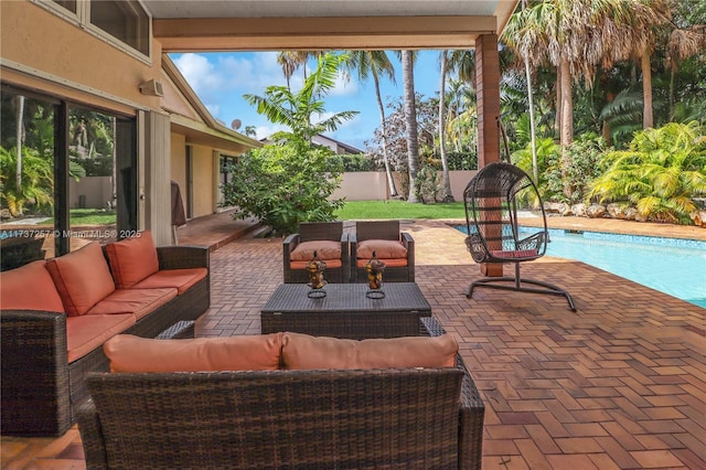 view of patio featuring an outdoor living space and a fenced in pool