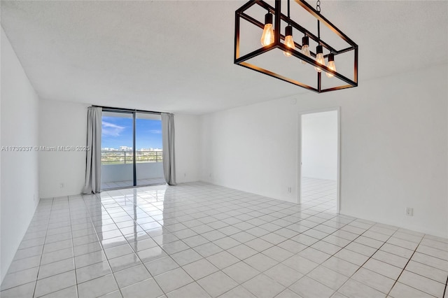 unfurnished room featuring light tile patterned floors