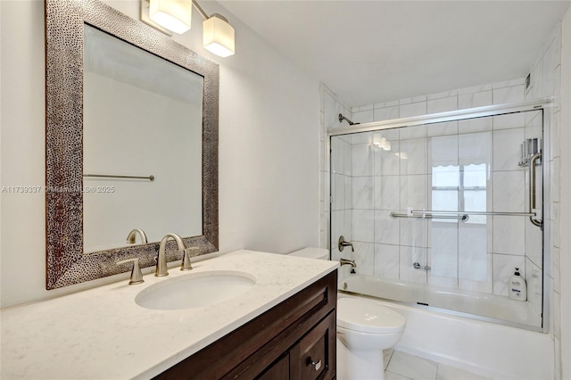 full bathroom with vanity, toilet, and combined bath / shower with glass door