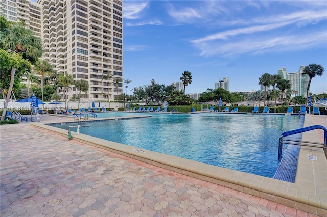 view of swimming pool with a patio area