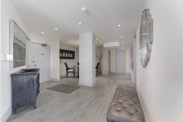 corridor featuring light hardwood / wood-style flooring