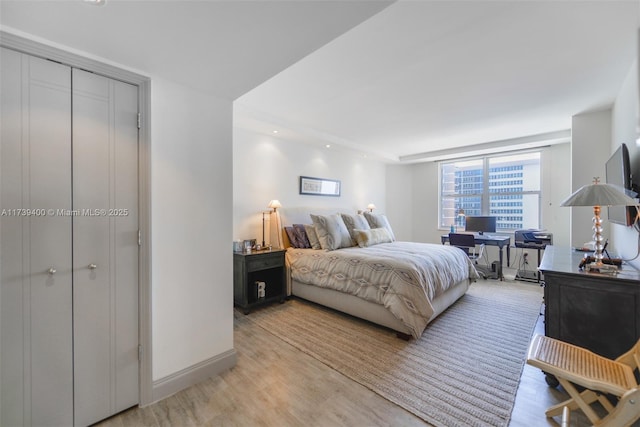 bedroom with light hardwood / wood-style flooring