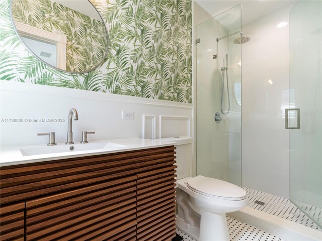 bathroom with vanity, toilet, and an enclosed shower