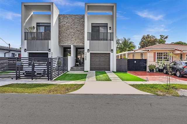 view of front of home with a garage and a balcony