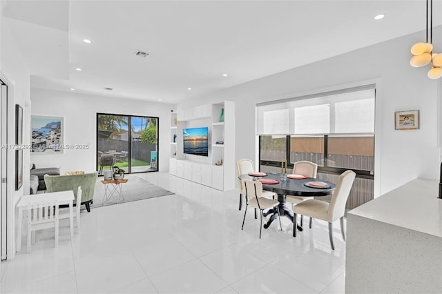 dining room with light tile patterned flooring and built in features