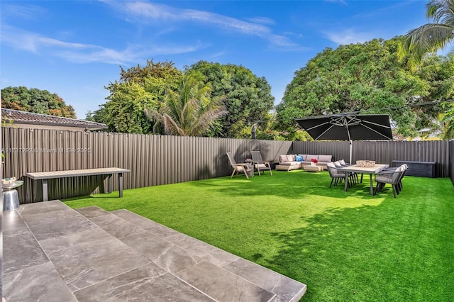 view of yard with an outdoor hangout area and a patio