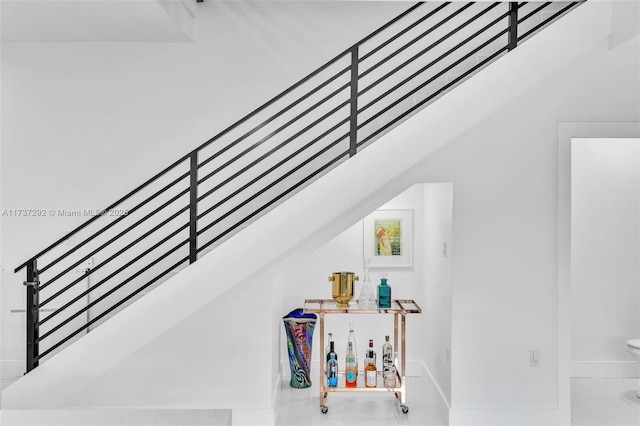 stairs featuring vaulted ceiling