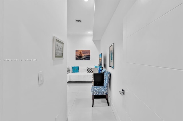 corridor with light tile patterned floors