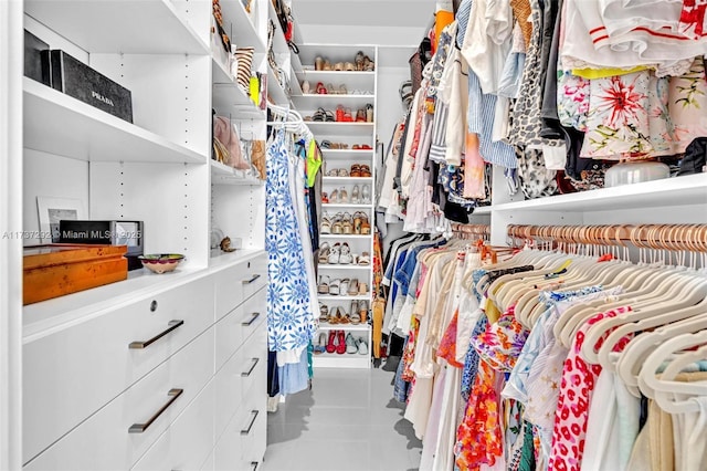 spacious closet featuring tile patterned flooring