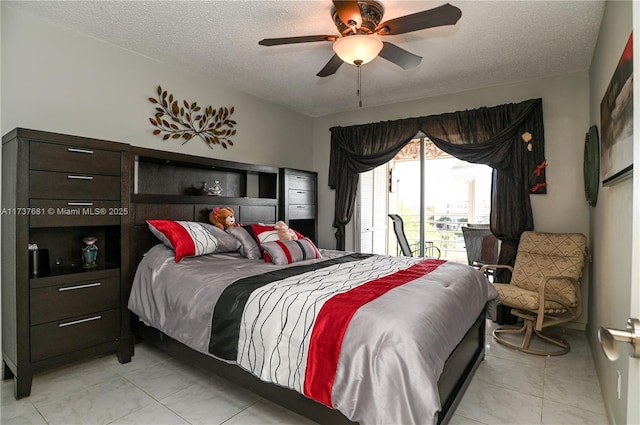bedroom featuring ceiling fan, access to outside, and a textured ceiling