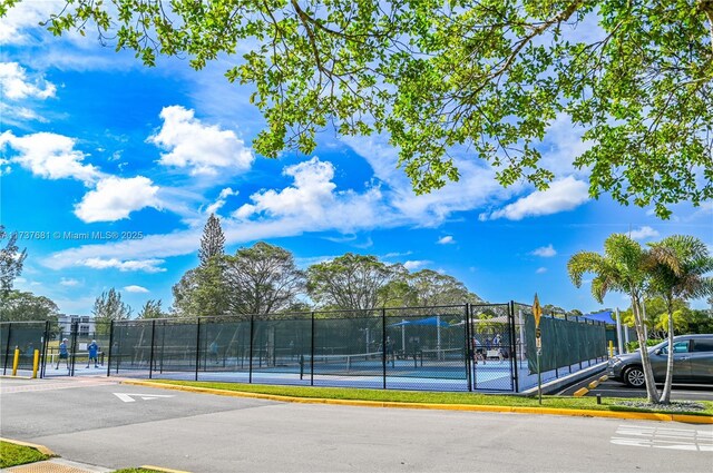 exterior space featuring tennis court