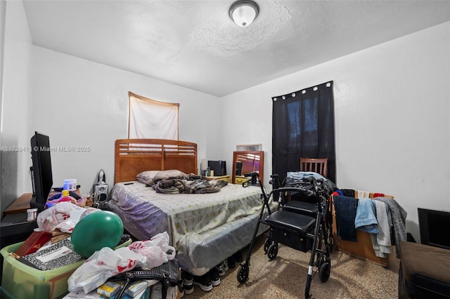 carpeted bedroom with a textured ceiling