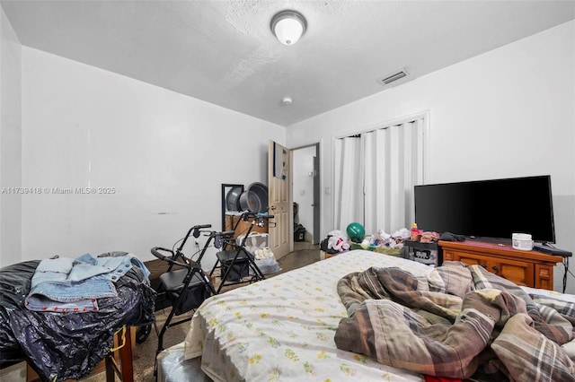 bedroom featuring a textured ceiling