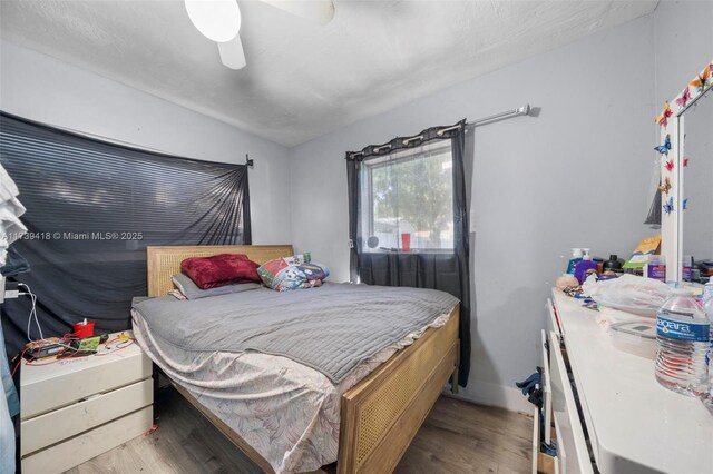 bedroom featuring light hardwood / wood-style flooring and ceiling fan