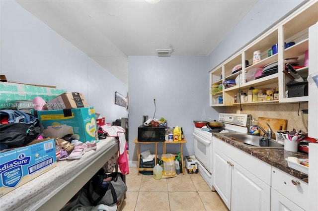 washroom with sink and light tile patterned floors