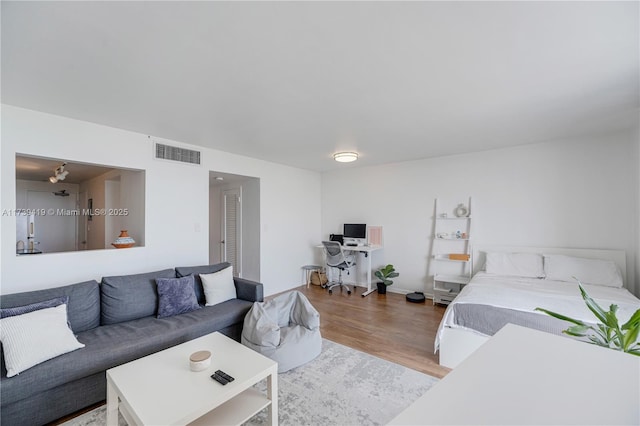 bedroom with hardwood / wood-style floors