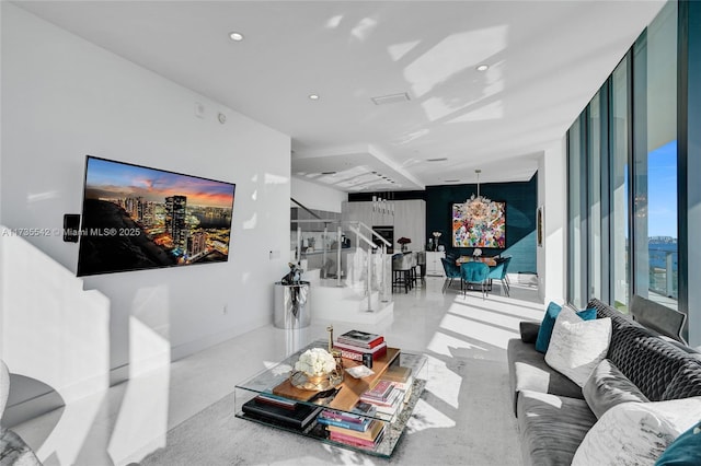 living room featuring a wall of windows